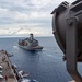 USS Ronald Reagan (CVN 76) conducts fueling-at-sea with USNS Tippecanoe (T-AO 199)