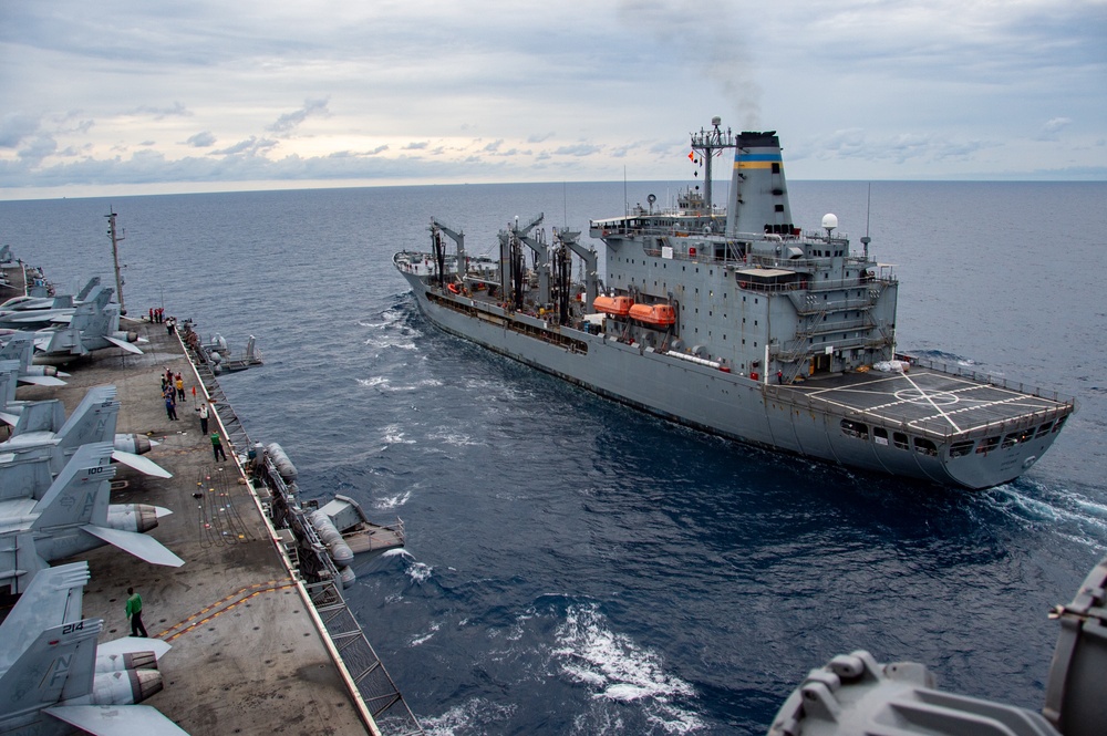 USS Ronald Reagan (CVN 76) conducts fueling-at-sea with USNS Tippecanoe (T-AO 199)