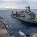 USS Ronald Reagan (CVN 76) conducts fueling-at-sea with USNS Tippecanoe (T-AO 199)