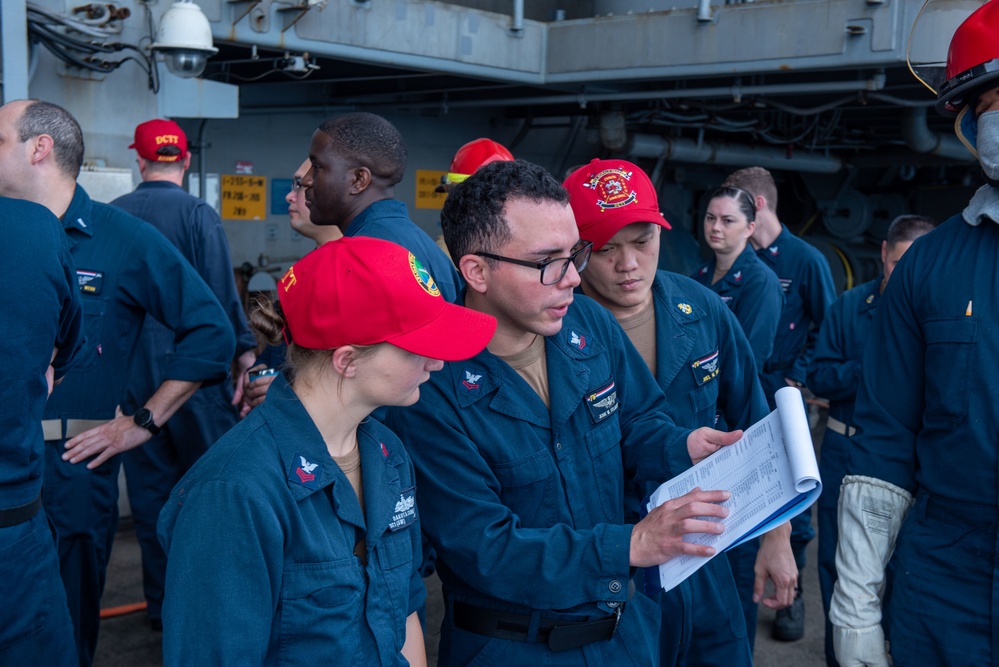 USS Ronald Reagan (CVN 76) Sailors conduct flooding response drill