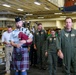 Royal Canadian Air Force Captain plays bagpipes aboard Abraham Lincoln during RIMPAC 2022