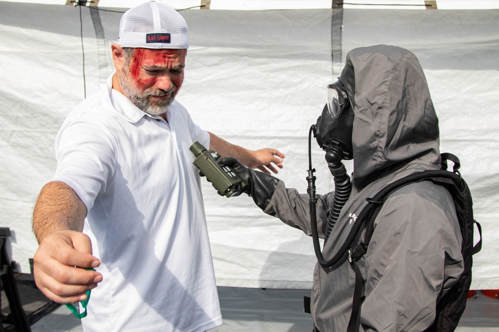 A US Soldier conducts decontamination operations in Philadelphia