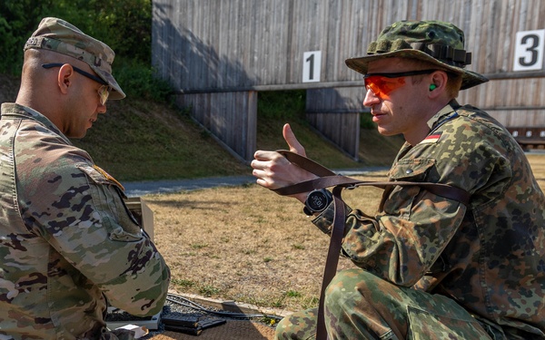 Staff Sgt. Devin Crawford receives tips from a German Reserve Soldier