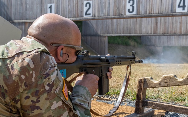 Capt. Thomas Wheeler fires a G3 rifle