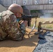 Capt. Thomas Wheeler fires a G3 rifle