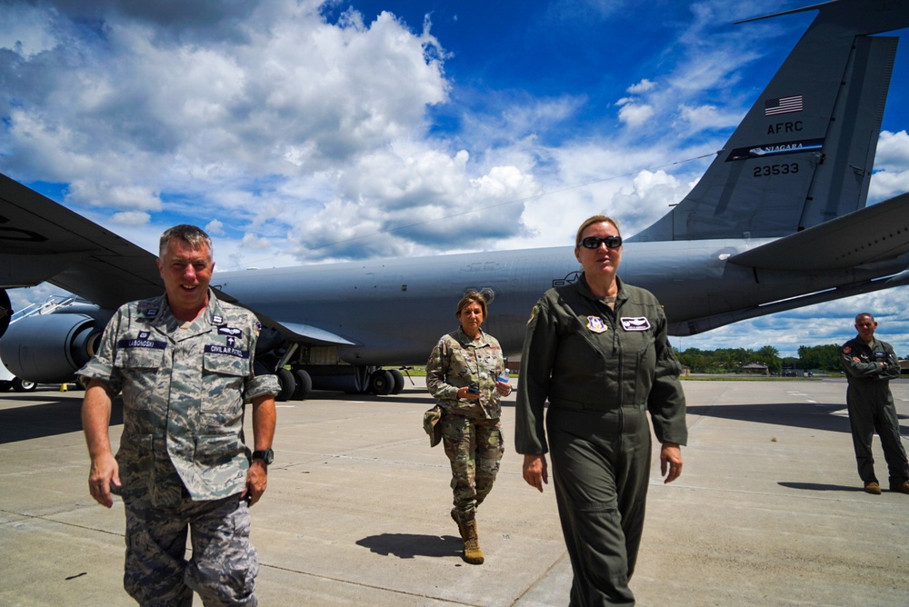 Wing commander walks with Civil Air Patrol cadre in front of KC-135