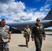 Wing commander walks with Civil Air Patrol cadre in front of KC-135