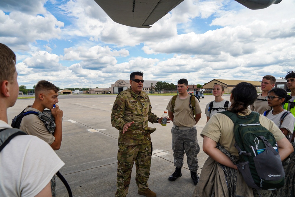 Group commander addresses cadets under the tail of a KC-135