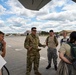 Group commander addresses cadets under the tail of a KC-135