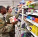 Airmen volunteers restock Commissary shelves