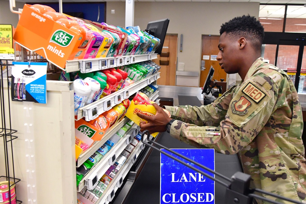 Airmen volunteers restock Commissary shelves