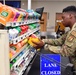 Airmen volunteers restock Commissary shelves