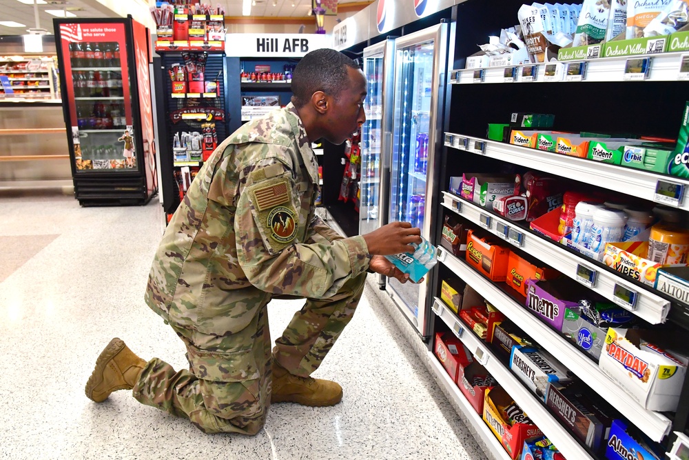 Airmen volunteers restock Commissary shelves