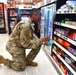 Airmen volunteers restock Commissary shelves