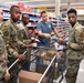 Airmen volunteers restock Commissary shelves