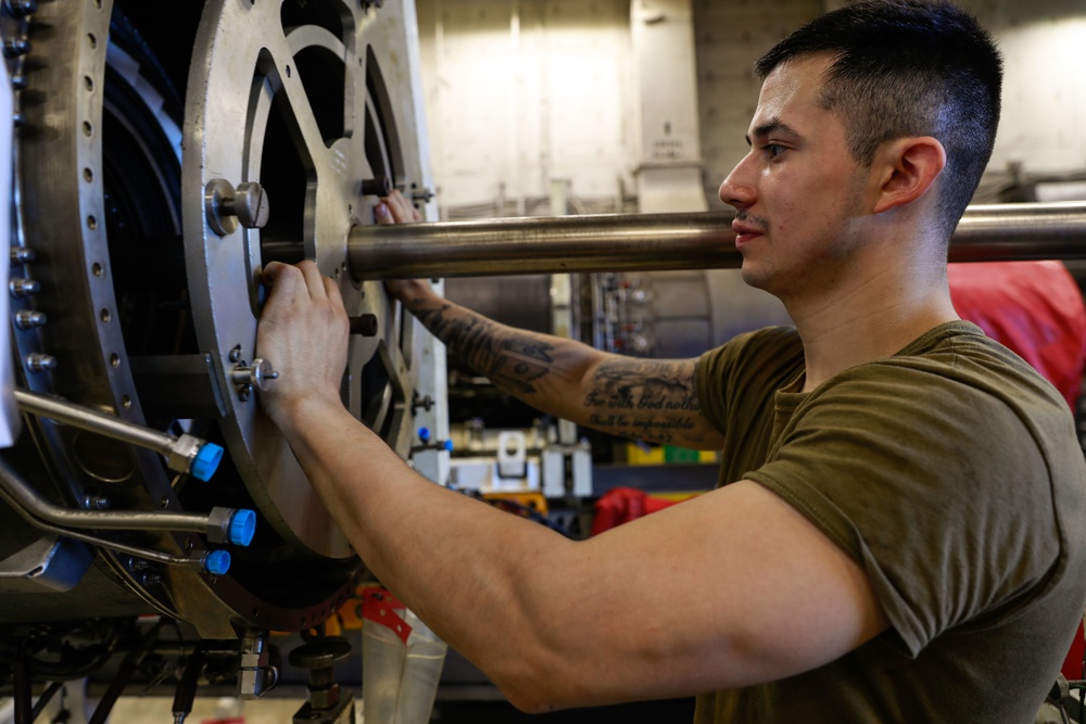 Abraham Lincoln Sailor conducts maintenance