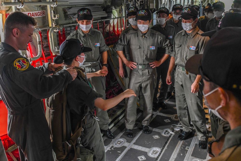 Air Cadets from the National Defense Academy of Japan tour aircraft assigned to the 36th and 459th Airlift Squadrons