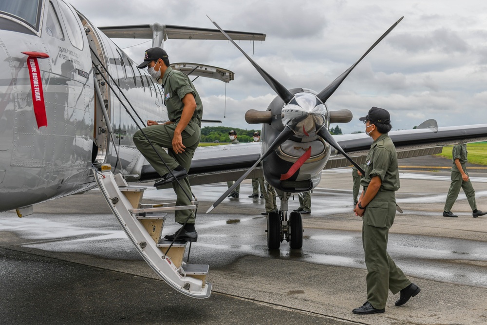 Air Cadets from the National Defense Academy of Japan tour aircraft assigned to the 36th and 459th Airlift Squadrons