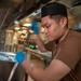 Culinary specialists prepare food for Sailors