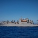 USNS William McLean replenishes USS Arlington via VERTREP