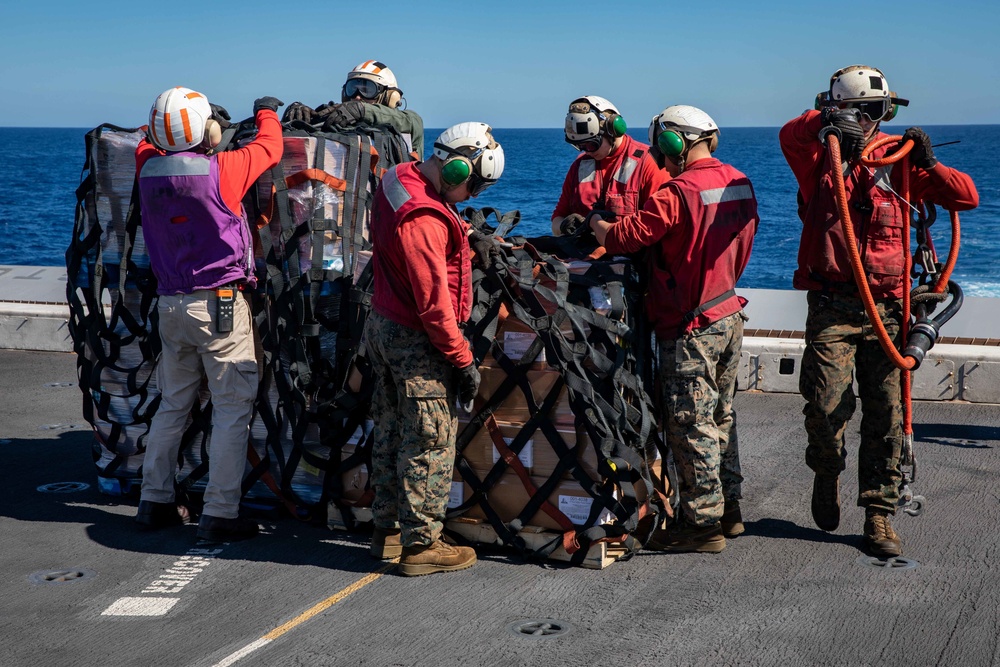 USNS William McLean replenishes USS Arlington via VERTREP