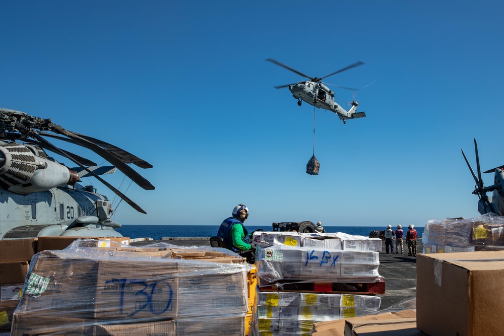 USNS William McLean replenishes USS Arlington via VERTREP