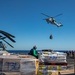 USNS William McLean replenishes USS Arlington via VERTREP