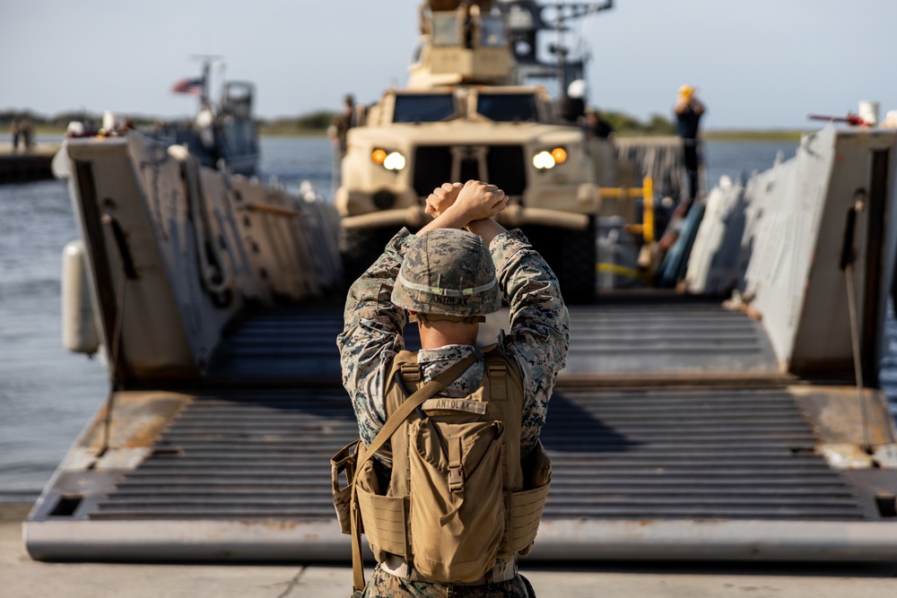 Combat Logistics Regiment 2 and 2nd Marine Division embark tactical vehicles aboard U.S. Navy landing craft during Technology Operational Experimentation Exercise 2022