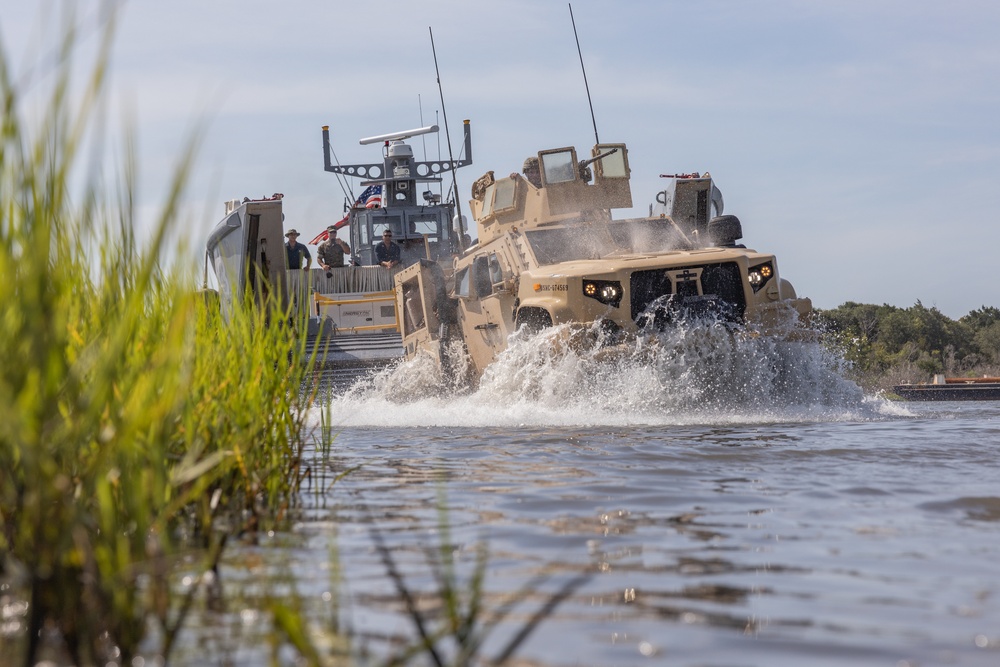 Combat Logistics Regiment 2 and 2nd Marine Division embark tactical vehicles aboard U.S. Navy landing craft during Technology Operational Experimentation Exercise 2022