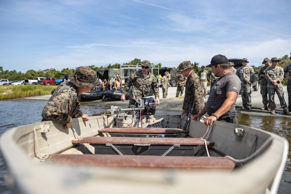 Combat Logistics Regiment 2 and 2nd Marine Division embark tactical vehicles aboard U.S. Navy landing craft during Technology Operational Experimentation Exercise 2022