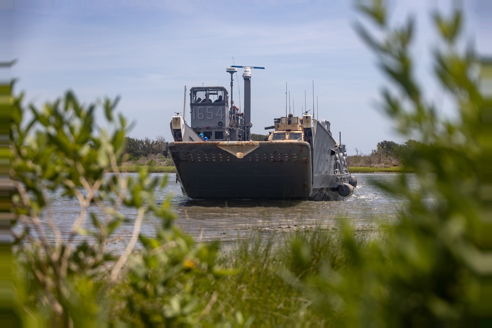 Combat Logistics Regiment 2 and 2nd Marine Division embark tactical vehicles aboard U.S. Navy landing craft during Technology Operational Experimentation Exercise 2022
