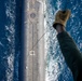 U.S. Marine Corps MV-22B Osprey resupplies U.S. Navy submarine