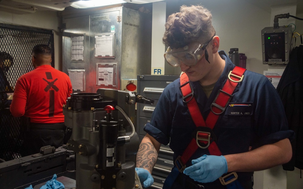 USS Ronald Reagan Sailors maintain weapons in armory