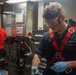 USS Ronald Reagan Sailors maintain weapons in armory