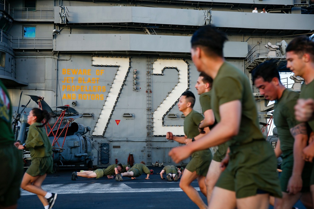 Black Knights of VMFA 314 exercise on the flight deck of Abraham Lincoln