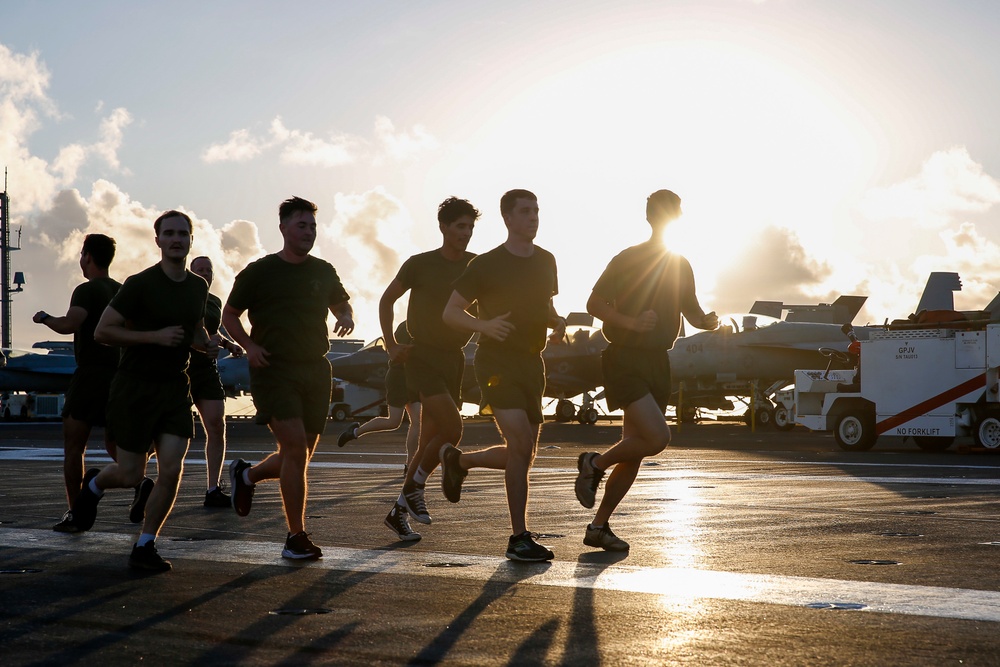 Black Knights of VMFA 314 exercise on the flight deck of Abraham Lincoln