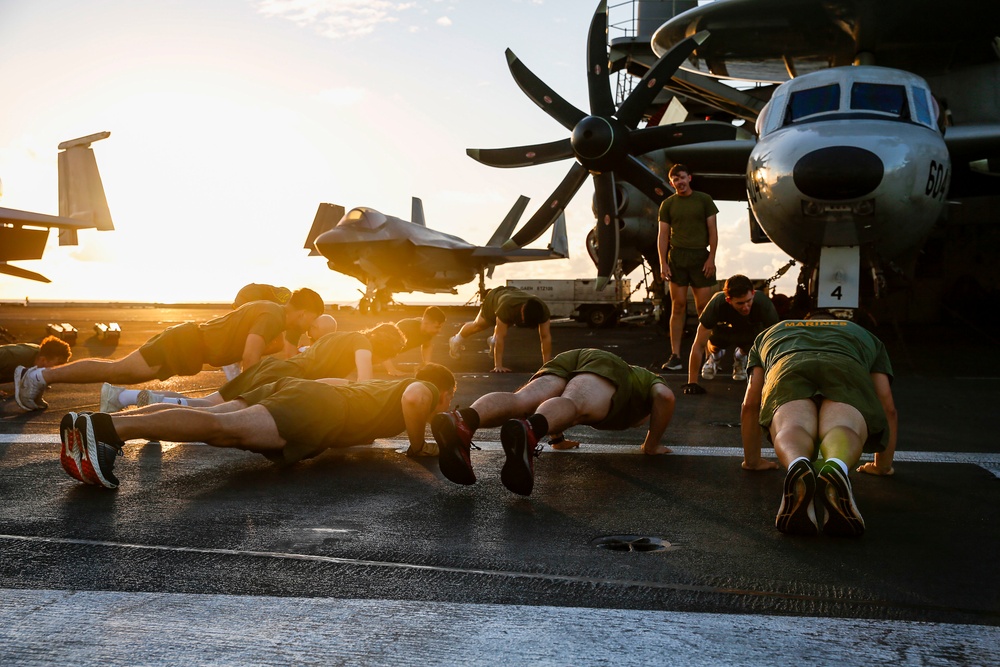 Black Knights of VMFA 314 exercise on the flight deck of Abraham Lincoln