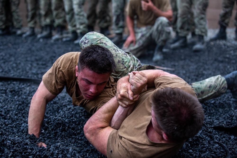 U.S. Naval Academy midshipmen take on U.S. Marine Corps Training