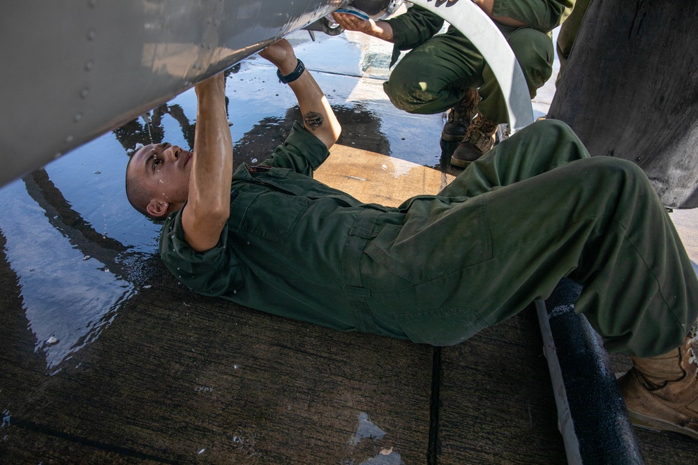 HMLA-775 conducts pre-flight maintenance