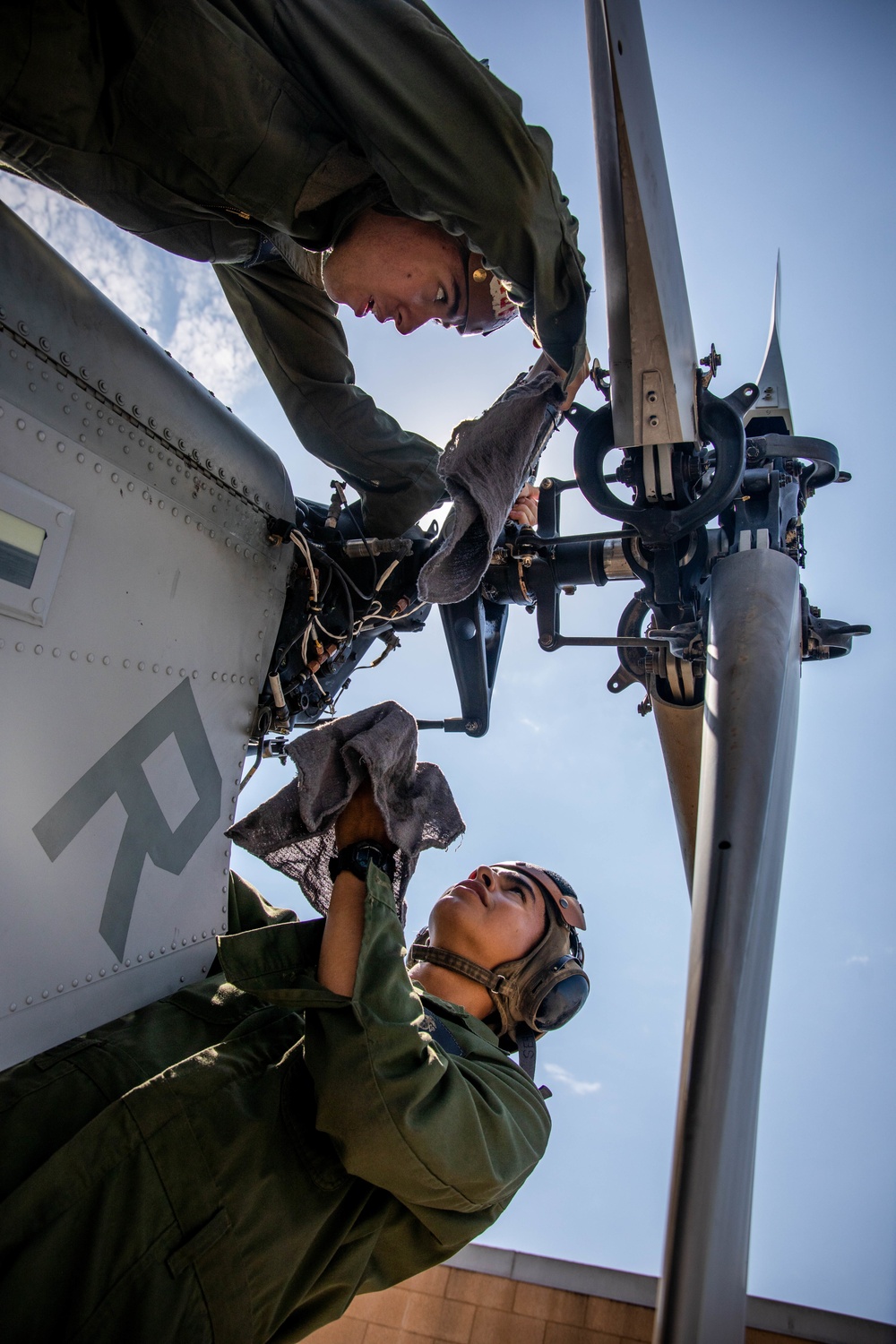 HMLA-775 conducts pre-flight maintenance during ITX