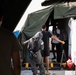 140th Chemical Company moves volunteers through a decontamination area