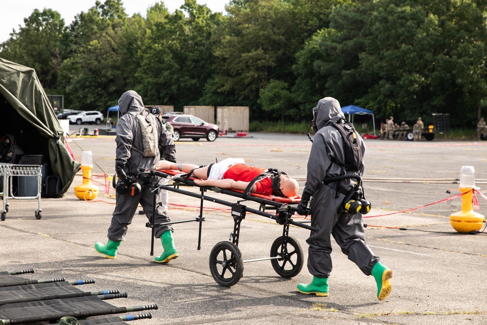 140th Chemical Company transport patients through decontamination area