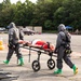 140th Chemical Company transport patients through decontamination area