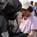 140th Chemical Company Soldier attaches injury category marker to a notionally injured civilian role player