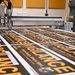 Garrison employee’s face with message innovation goes theater-wide