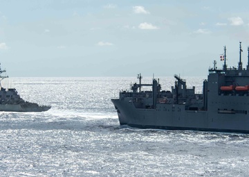 USS Ronald Reagan (CVN 76) conducts replenishment-at-sea with USNS Carl Brashear (T-AKE 7)