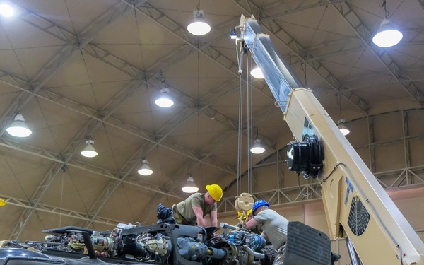 90th ASB, 11th CAB Soldiers install helicopter parts