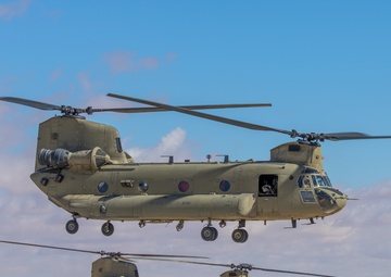 2 CH-47 Chinooks take off during mission