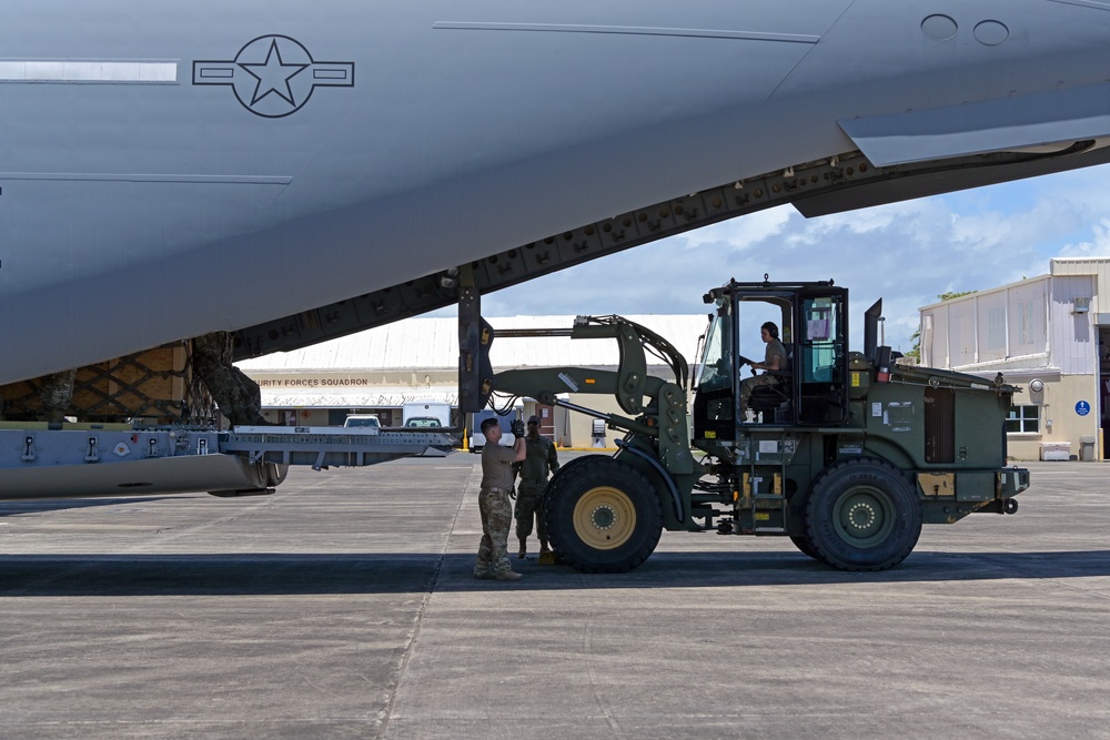 621st CRW offloads cargo being transferred to 156th CRG