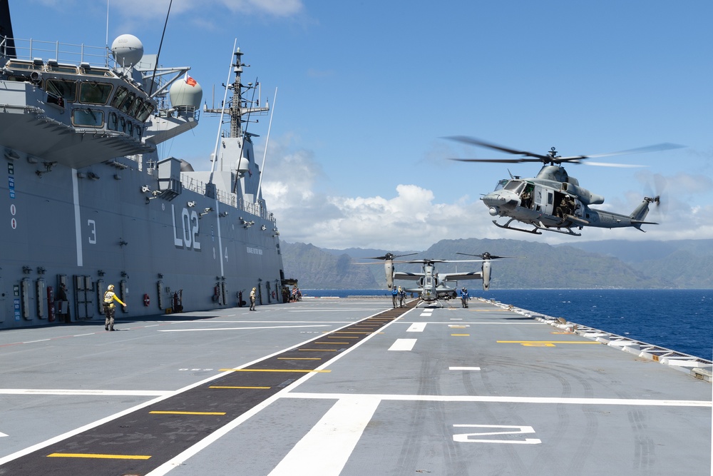 UH-1Y Venom and AH-1Z Viper refuel on HMAS Canberra